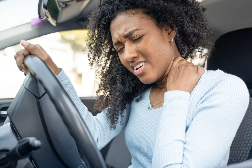 A driver holding her neck after a collision in Allentown