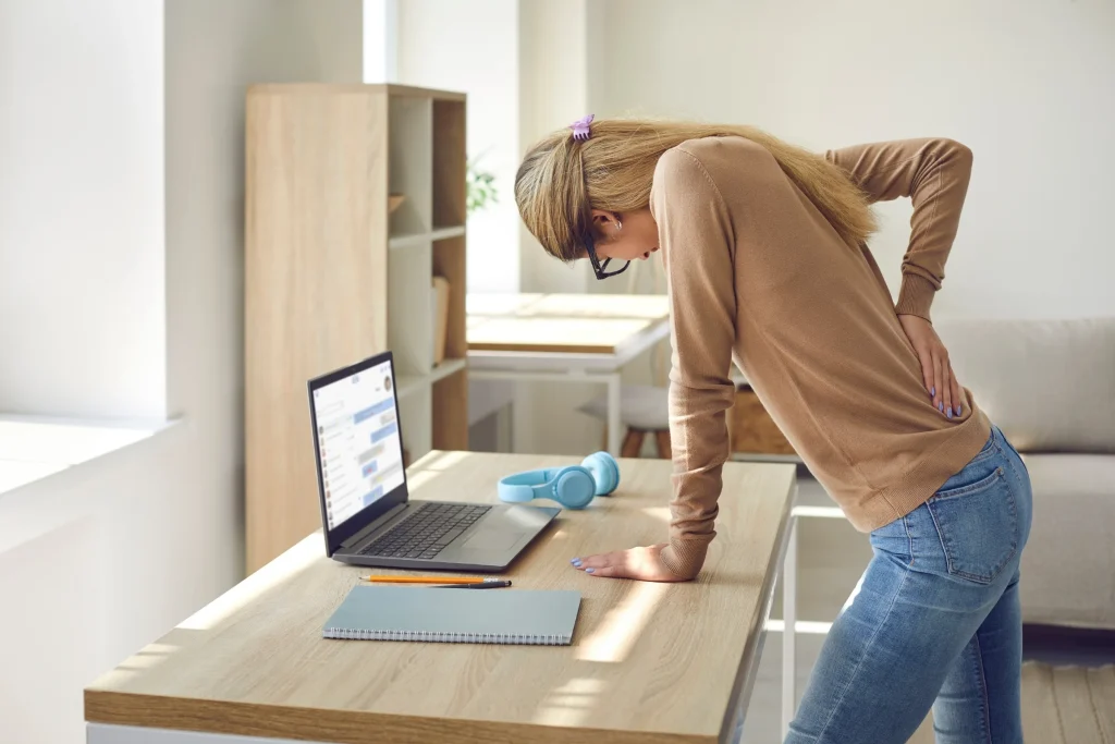 Standing up from a desk, the moment sciatica usually announces itself
